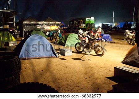 COPIAPO - JANUARY 11: Tents and bikes inside the bivouac during the night  on Rally Dakar 2011 Argentina Chile, January 11 in Copiapo Chile.