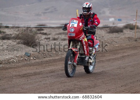 COPIAPO - JANUARY 11: Wenmin Su from China riding his bike during his participation on Rally Dakar 2011 Argentina Chile, January 11 in Copiapo Chile.