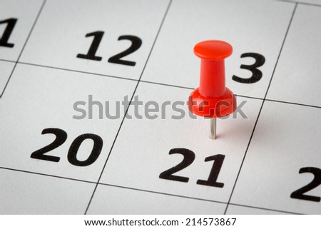 Concept image of a calendar with red push pins. Available in high resolution
