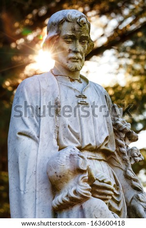 Religious Statue With Sun Flare