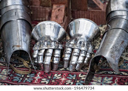 Antique metallic medieval armor gloves detail