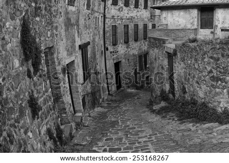 Tuscany san quirico medieval houses stone wall  in black and white