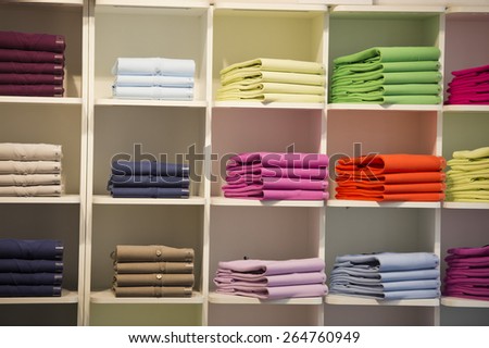 different colors polo shirt on display stand