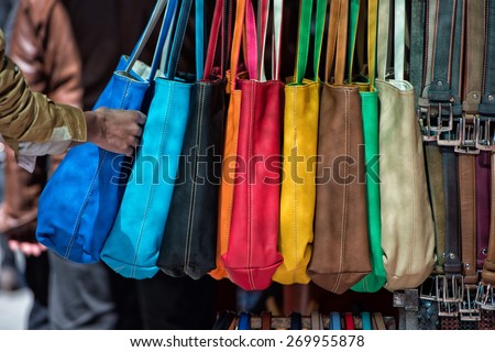 different colors leather woman bags on display