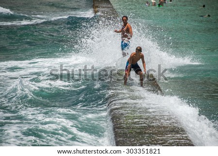 HONOLULU, USA - AUGUST. 14 2014 - People having fun at waikiki beach in Hawaii Oahu island