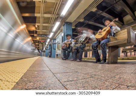 NEW YORK - USA - 13 JUNE 2015 - Mexican guitars players in metro station