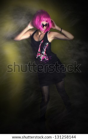 Rock and roll girl dancing in the night club