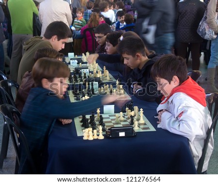 VALENCIA - NOVEMBER 18: Chess School Tournament on November 18, 2012 in Valencia, Spain. Unidentified students of The Chess School of Valencia compete for prizes in a popular chess tournament.