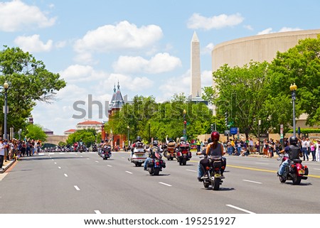 WASHINGTON, DC, USA - MAY 25, 2014: Motorbikes travel towards National Monument as part of Rolling Thunder motorcycle ride for American POWs and MIA soldiers on May 25, 2014 in Washington, DC, USA