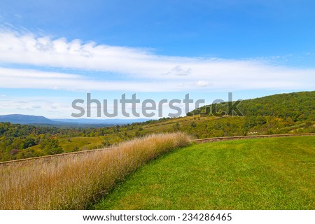 Green meadows and hills of countryside in Virginia. Countryside natural landscape on sunny afternoon.