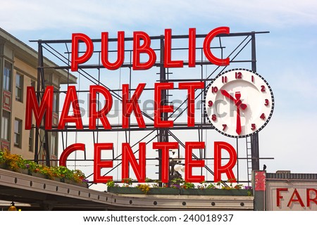 SEATTLE, USA - JUNE 16, 2013: Public Market Center sign in Seattle downtown on June 16, 2013. Pike street market is famous for fresh produce, delicious food and unique arts and crafts.