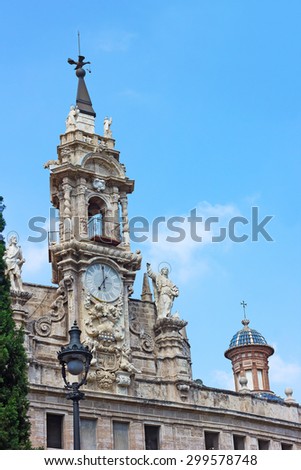 A clock tower of the Saint John of the Market church in Valencia, Spain. One of oldest churches in Valencia with the tower clock.