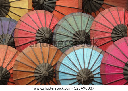 Multicolored Asian sunshade protect against rain and sun.