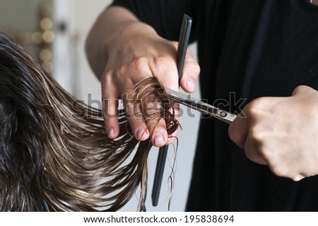 Woman gets their hair cut.