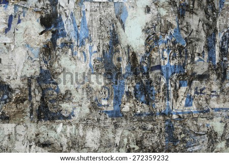 Background of old wall with poster residues.