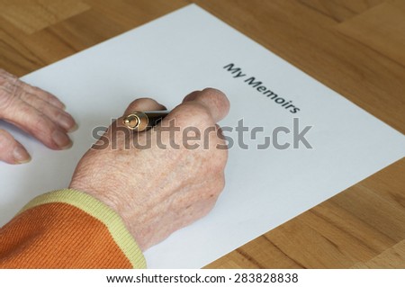 Senior writes her memoirs on a white sheet of paper with heading.
