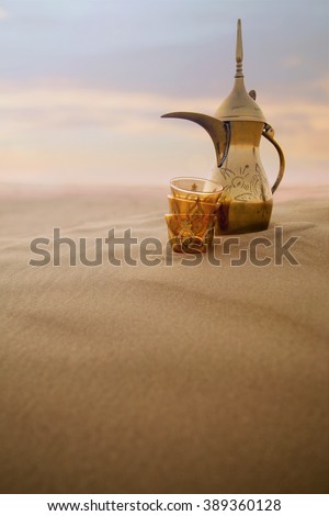 Arabic coffe pot on desert dunes