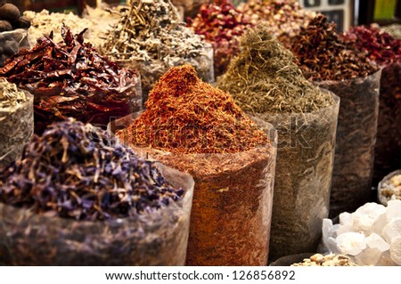 Oriental spice market - bags full of variety of spices: pepper, saffron and others