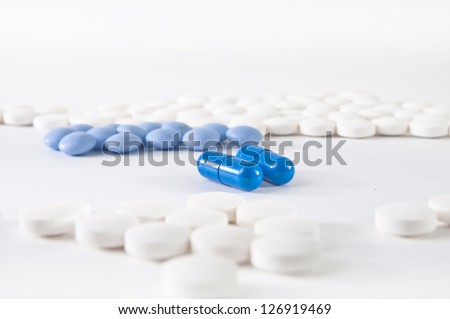 Medical background - blue and white pharmaceuticals on white background