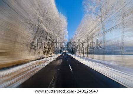 Driving fast on a sunny day at winter - safety on the road