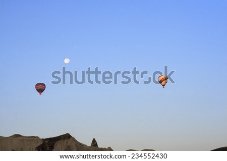 CAPPADOCIA, TURKEY, AUGUST, 12 : Early morning in Cappadocia, Turkey, dozens of hot air balloons offer guests from all over the world spectacular  views of the Cappadocian landscape on Augurt 12, 2014