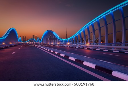 Amazing night dubai VIP bridge with beautiful sunset. Private road to Meydan race course, Dubai, United Arab Emirates