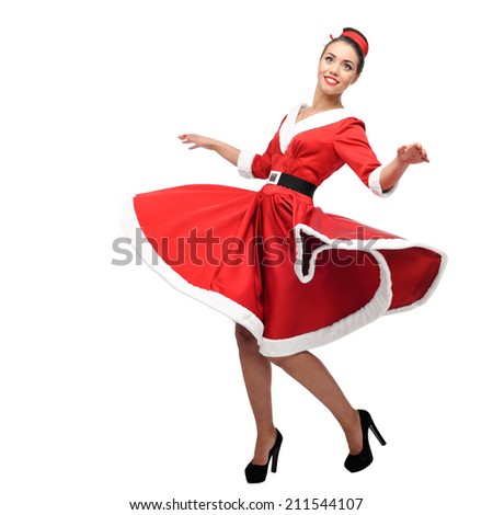 cheerful young caucasian woman in red vintage clothing dancing isolated on white