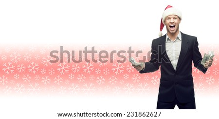 screaming young business man in santa hat holding money over winter snowflakes background