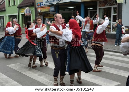 ZYWIEC, POLAND - AUGUST 6: Participants of the 46th Beskidy Highlanders Week of Culture (TKB), the biggest folk culture event in Eastern Europe, parade through the city, folk group from Czech Republic