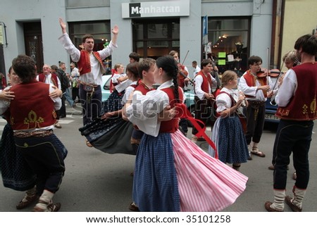ZYWIEC, POLAND - AUGUST 6: Participants of the 46th Beskidy Highlanders Week of Culture (TKB), the biggest folk culture event in Eastern Europe, parade through the city, folk group from Czech Republic