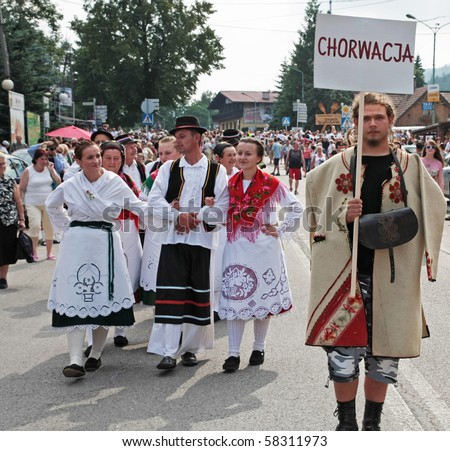 SZCZYRK, POLAND–AUGUST 1: Participants of the 47th Beskidy Highlanders Week of Culture (TKB), the biggest folk culture event in Eastern Europe, parade through the city, folk group from Croatia on August 1, 2010 in Szczyrk, Poland