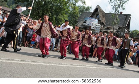 SZCZYRK, POLAND–AUGUST 1: Participants of the 47th Beskidy Highlanders Week of Culture (TKB), the biggest folk culture event in Eastern Europe, parade through the city, folk group from Israel on August 1, 2010 in Szczyrk, Poland