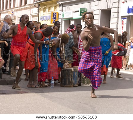 ZYWIEC, POLAND - AUGUST 5: Participants of the 47th Beskidy Highlanders Week of Culture (TKB), the biggest folk culture event in Eastern Europe, parade through the city, folk group from Kenya on August 5, 2010 in Zywiec, Poland