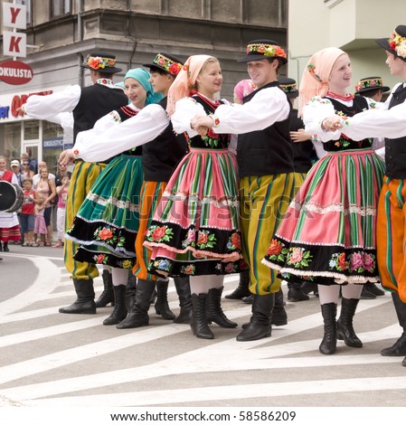 ZYWIEC, POLAND - AUGUST 5:  Participants of the 47th Beskidy Highlanders Week of Culture (TKB), the biggest folk culture event in Eastern Europe, parade through the city, folk group from Poland on August 5, 2010 in Zywiec, Poland