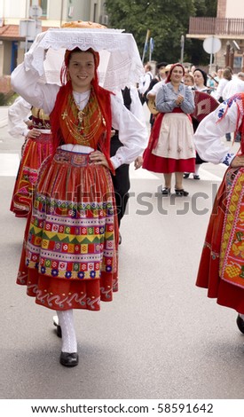 ZYWIEC, POLAND - AUGUST 5: Participants of the 47th Beskidy Highlanders Week of Culture (TKB), the biggest folk culture event in Eastern Europe, parade through the city, folk group from Portugal on August 5, 2010 in Zywiec, Poland