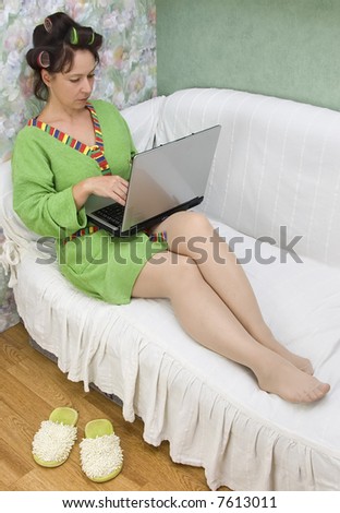 The woman in house conditions with a computer