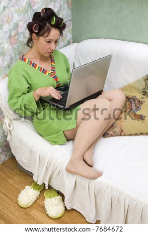 The woman in house conditions with a computer