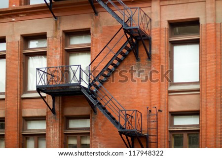 External fire escape staircase on an old brick building
