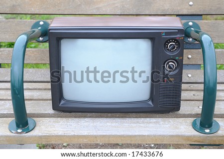 Old TV on a bench