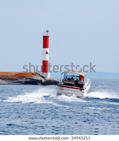 Boat passing a light beacon