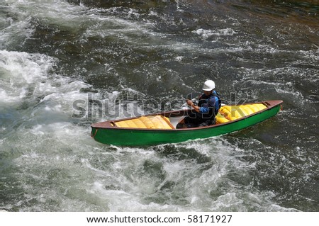 Canoe In Rapids