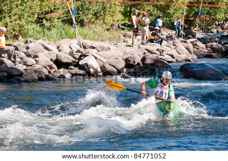 MINDEN, ONTARIO - SEPT. 10 : An unidentified contestant competes at Open Canoe Whitewater Slalom, 2011 at Gull River on September 10, 2011 in Minden, Ontario, Canada.