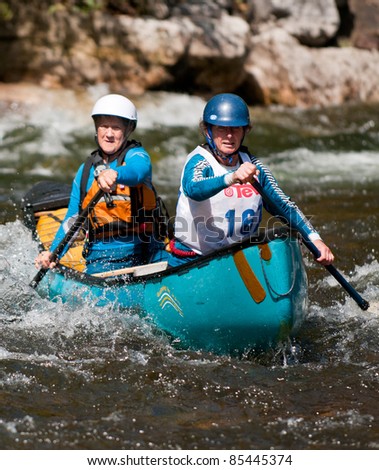 MINDEN, ONTARIO - SEPT 10. Two unidentified contestants compete at Open Canoe Slalom Race, on September 10, 2011 at Gull River in Minden, Ontario, Canada.