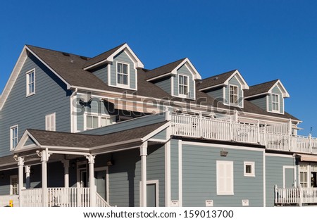 Townhomes with balconies and dormer windows