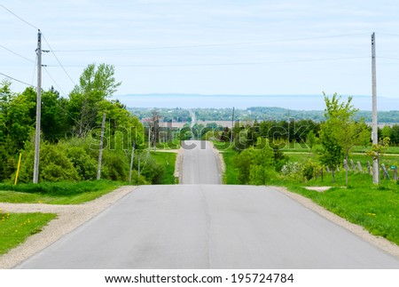 Rural road through rolling hills in central Ontario