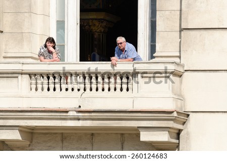 HAVANA - FEB 13: Elderly couple smoking cigarettes on their balcony in Havana, Cuba on Feb. 13, 2015. Many people in Cuba are still smoking tobacco products.