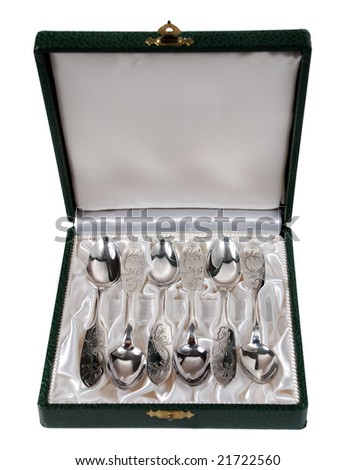 Silver spoons in a green leather box