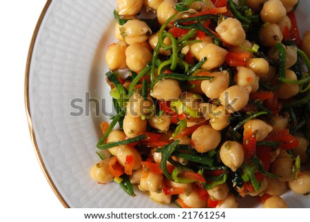 chickpea salad on a plate isolated on white