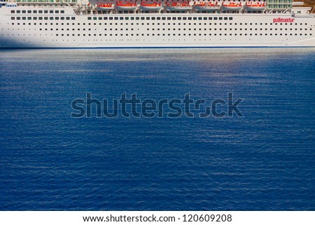 Cruise ship side from distance at Mykonos Port cyclades Greece