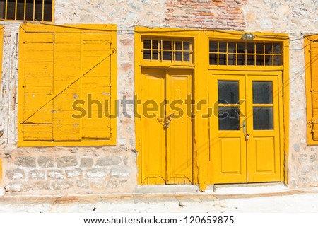 Yellow door frame in Greece Island Hydra Saronikos Gulf